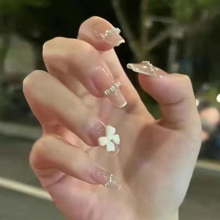 Artificial nails with elegant bow accents and pearl decorations Kalsten