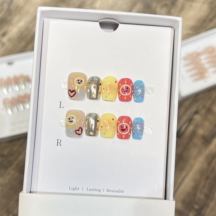 Whimsical Press-On Nail Art Set with Smiley Faces and Floral Designs Kalsten