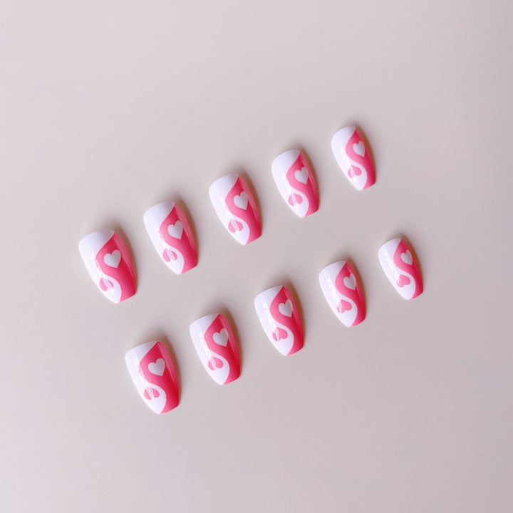 Artificial nails with heart motif and floral accents Kalsten