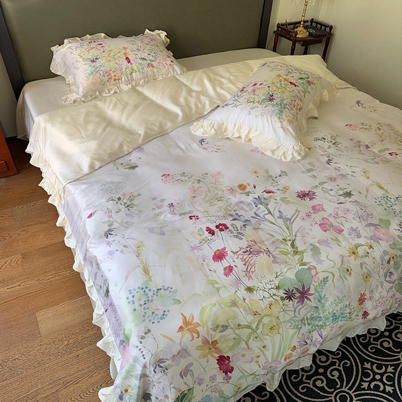 Cotton satin bed linen set with delicate watercolor botanical print and decorative ruffle