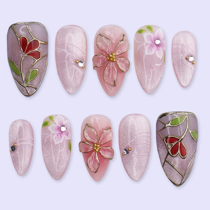 Artificial nail set with luxurious floral designs and glitter accents Kalsten