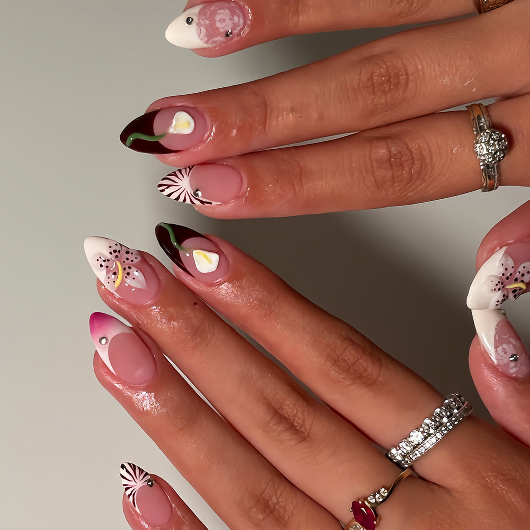 Artificial nails with creative floral designs and glitter accents Kalsten