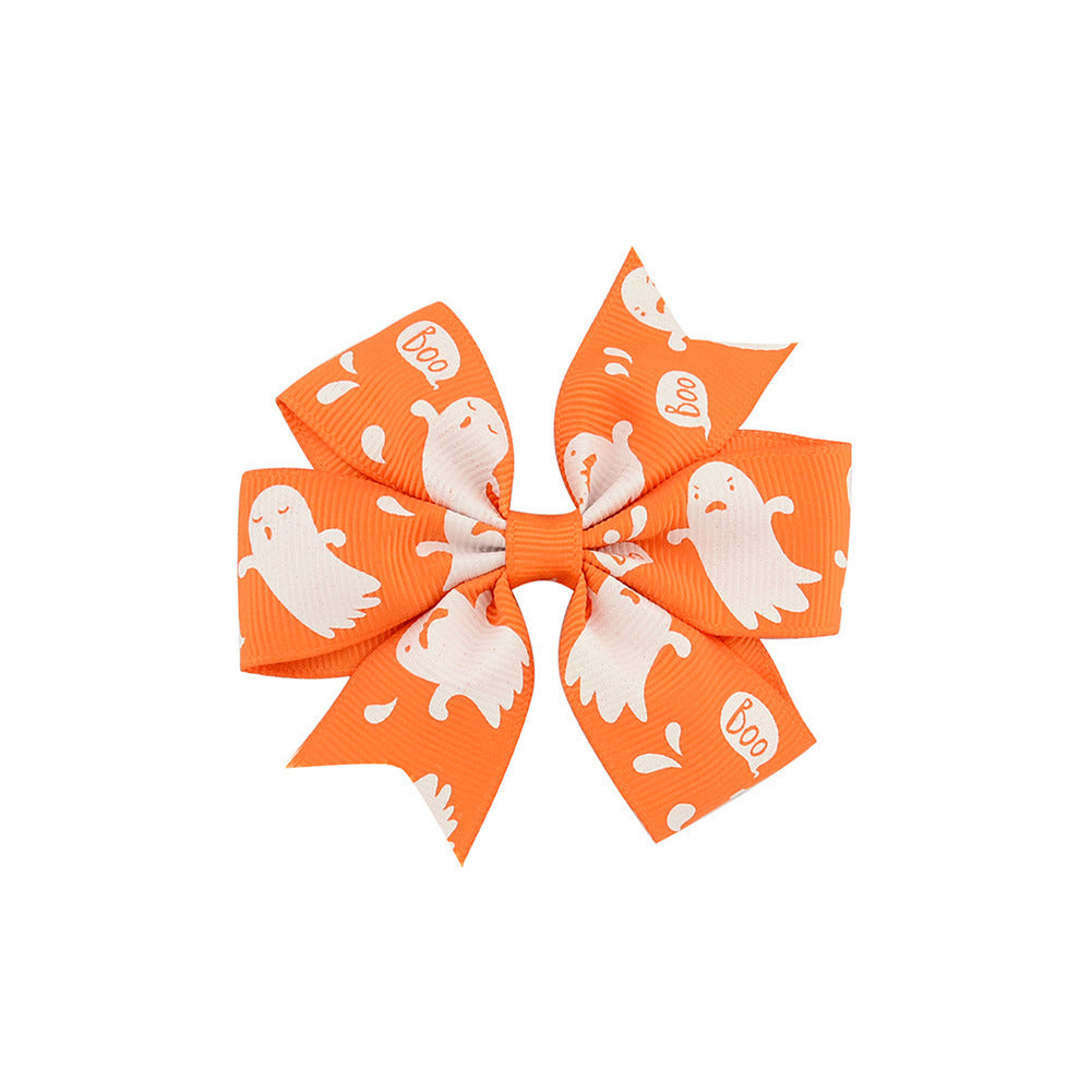 Halloween bow with pumpkin and witch motifs