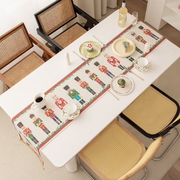 Festive woven table runner with nutcracker motif and golden fringes Kalsten