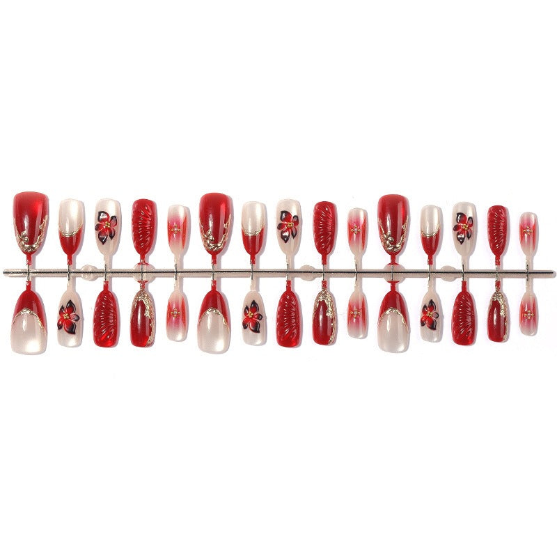 Acrylic nail set with floral design and elegant glitter details Kalsten