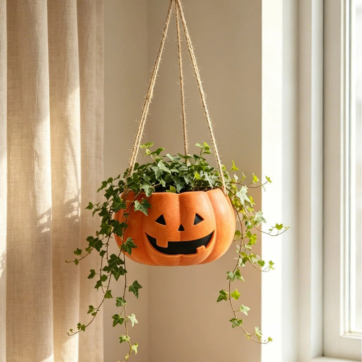 Hanging ceramic pumpkin flower pot with carved pumpkin face and jute string