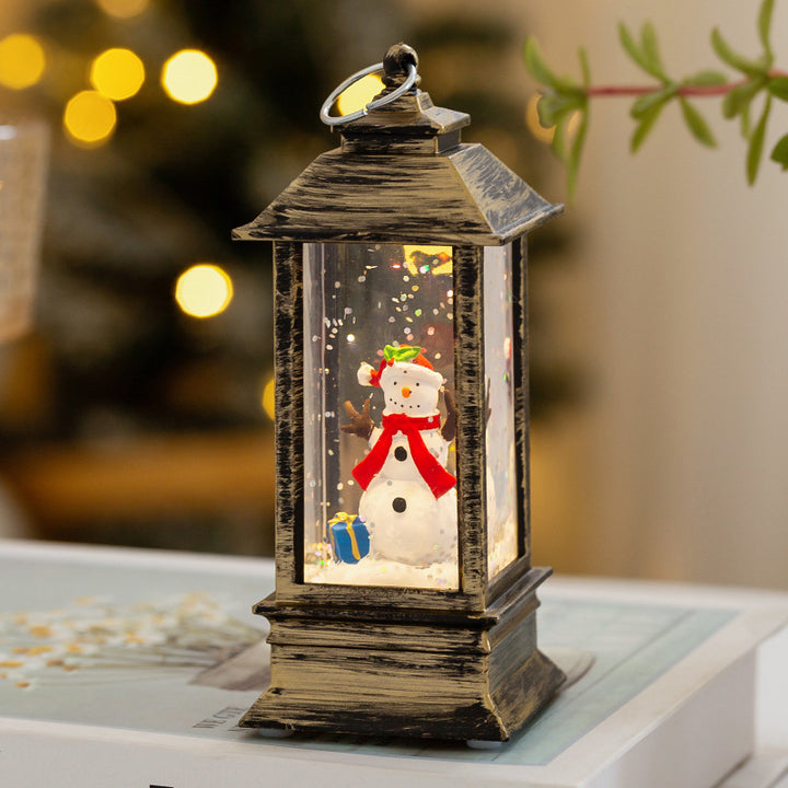 Christmas lantern with LED lighting and decorative snow effect