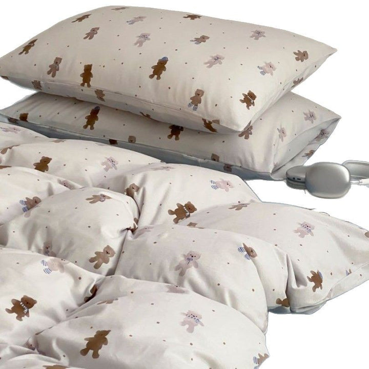 Light cotton bedding set with quilted topper and fine stripe pattern