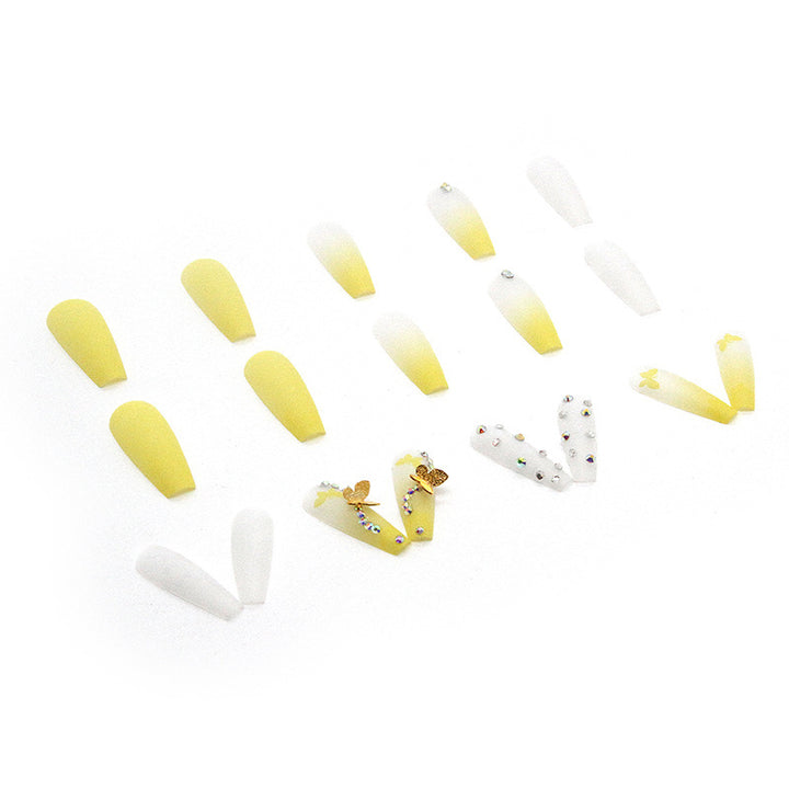 Artificial nail extensions with floral accents and rhinestones Kalsten
