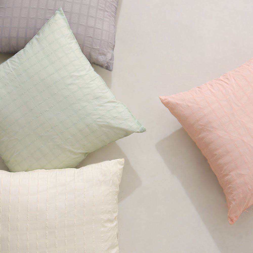 Square decorative cushion with delicate mother-of-pearl look and fine micro tuft structure