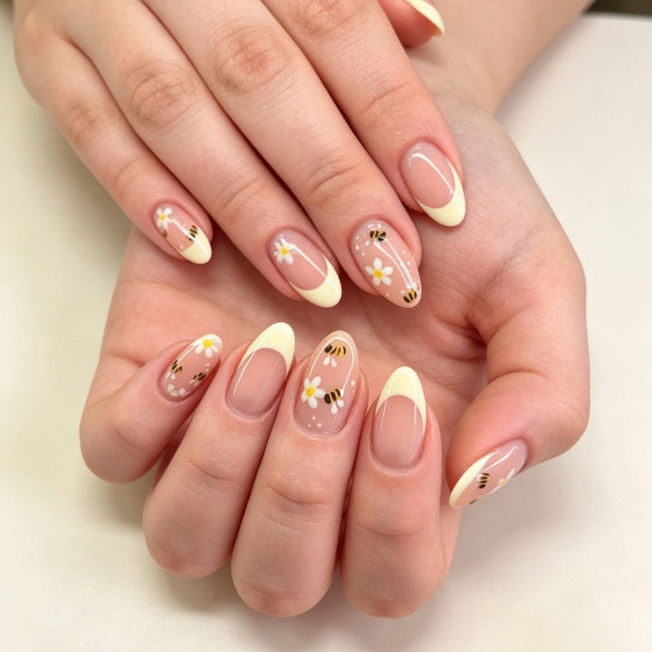 Artificial nails with elegant French tip and floral accents Kalsten