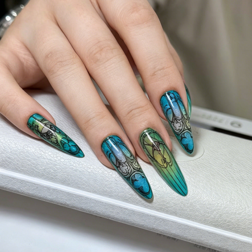 Artificial nails in elegant stiletto design with elaborate motifs Kalsten