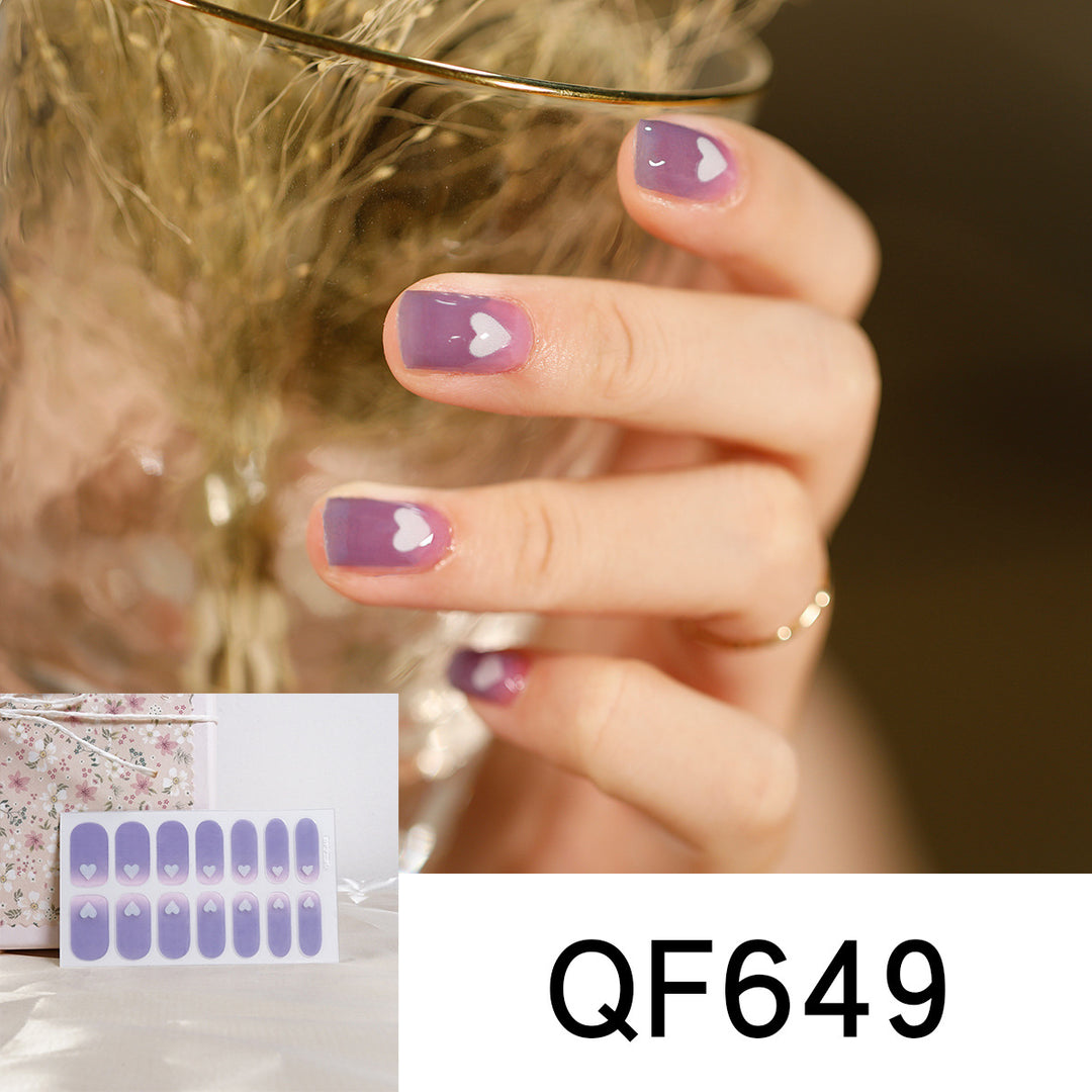 Artificial nail art with heart-shaped designs and soft color gradients Kalsten