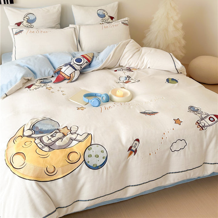 Child bedding set made of soft cotton blend with embroidered astronaut and rocket motif