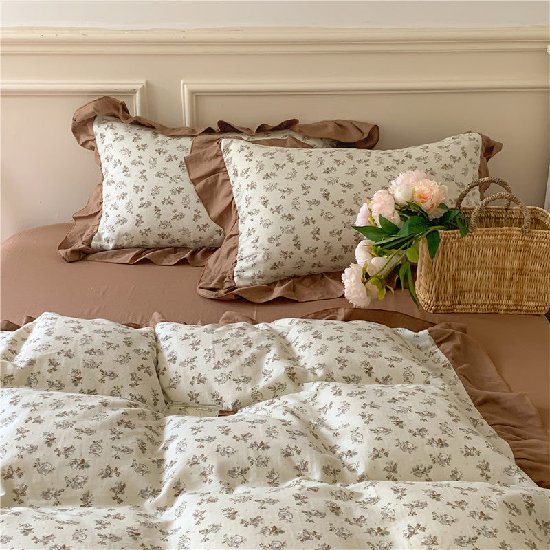 Romantic bed linen complete set made of cotton percale with delicate floral print, ruffle trim, and silky-matte finish