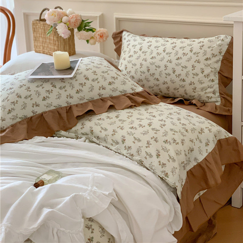 Romantic bed linen complete set made of cotton percale with delicate floral print, ruffle trim, and silky-matte finish