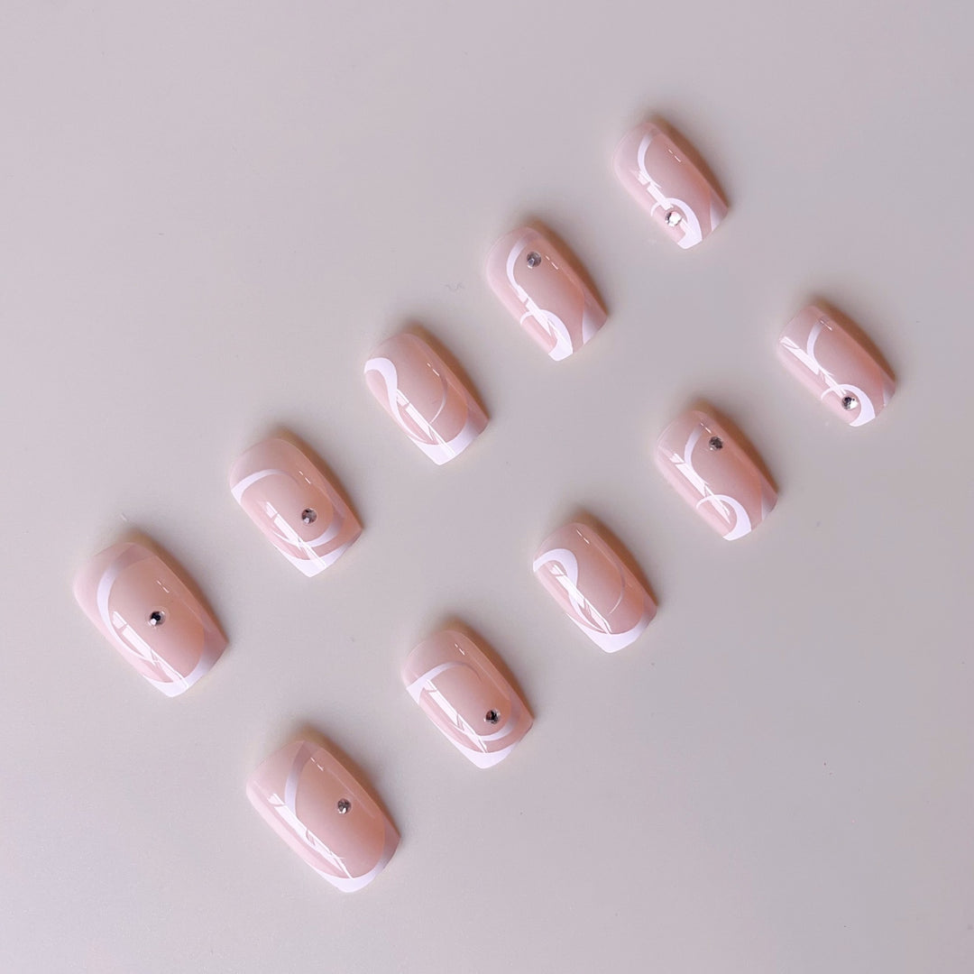 Artificial nail set with elegant French tips and glamorous rhinestone decorations Kalsten