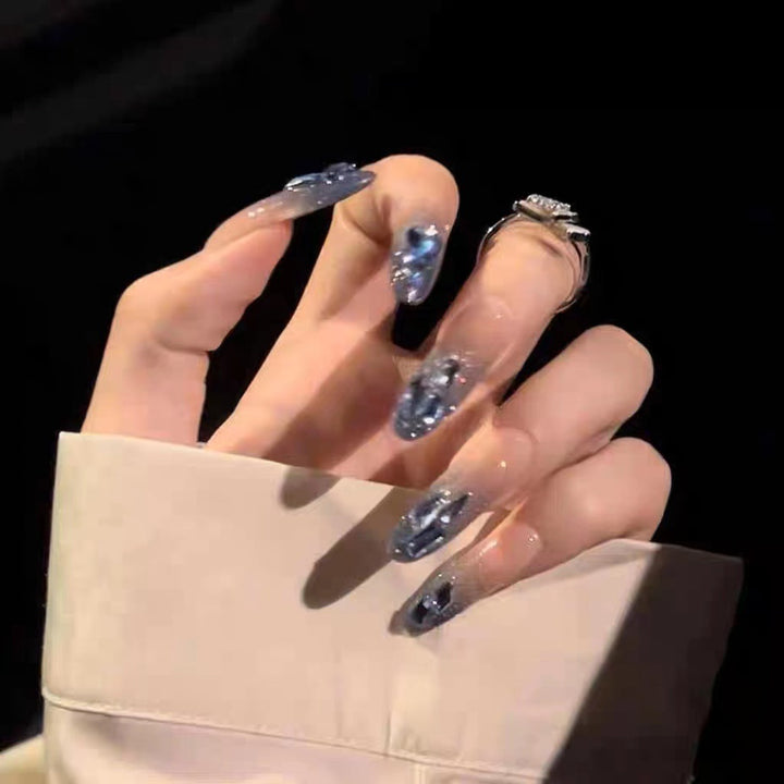 Glamorous artificial nails with delicate flower and glitter effects Kalsten