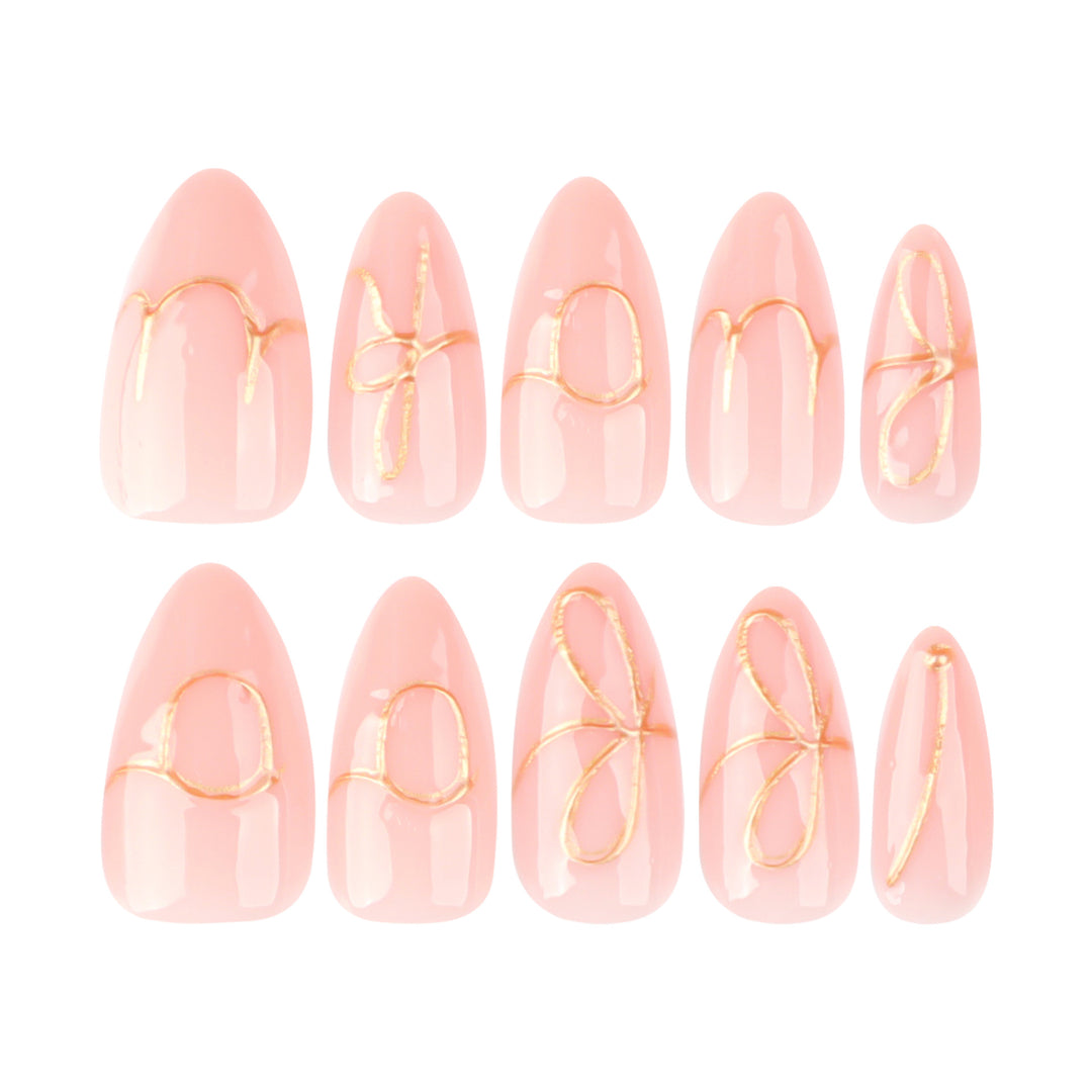 Creative nail art with golden accents and trendy lettering Kalsten