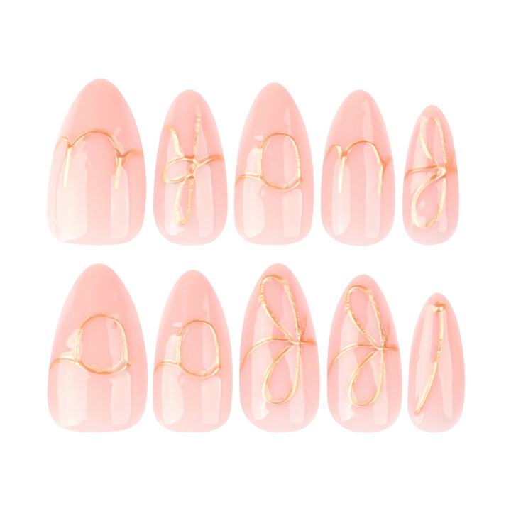 Creative nail art with golden accents and trendy lettering Kalsten
