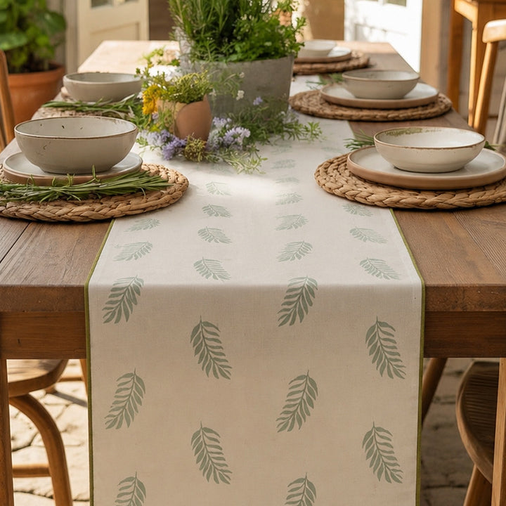Woven table runner in botanical leaf pattern made of cotton blend Kalsten