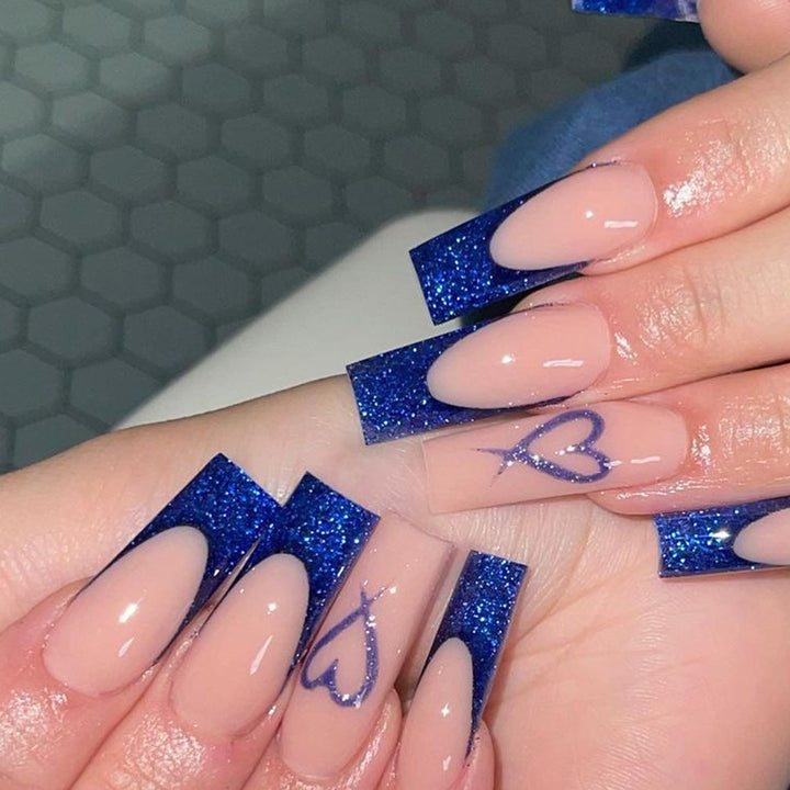 Artificial nails with glitter accents and unique heart design Kalsten