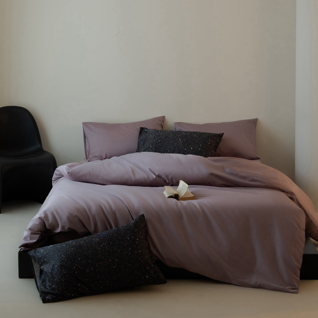 Luxurious cotton satin bedding set with contrasting patterned pillows