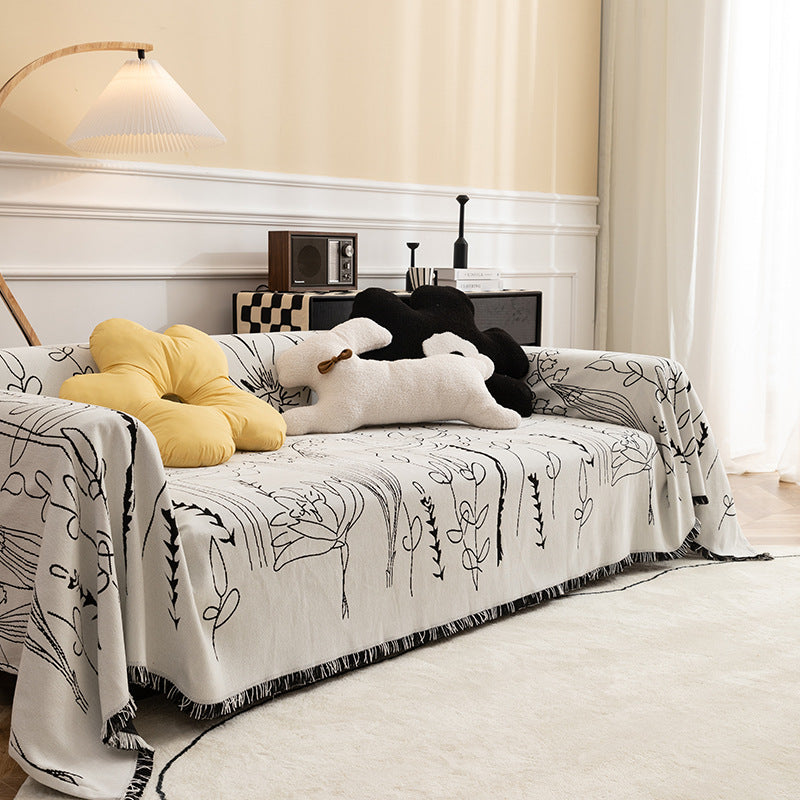 Fine woven sofa cover and furniture throw with floral line drawing and decorative fringed edge Kalsten