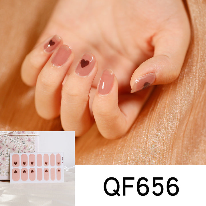 Artificial nail art with heart-shaped designs and soft color gradients Kalsten