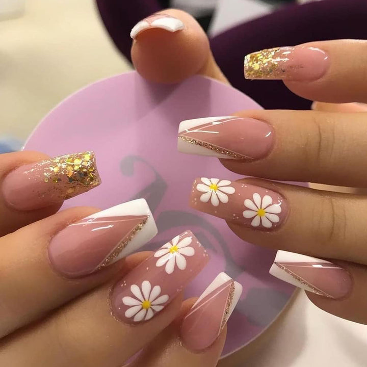 Artful nail extensions with floral designs and glitter accents Kalsten