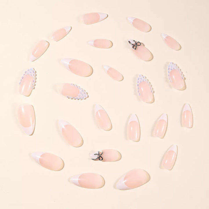 Acrylic nail set with elegant pearl and bow decorations Kalsten