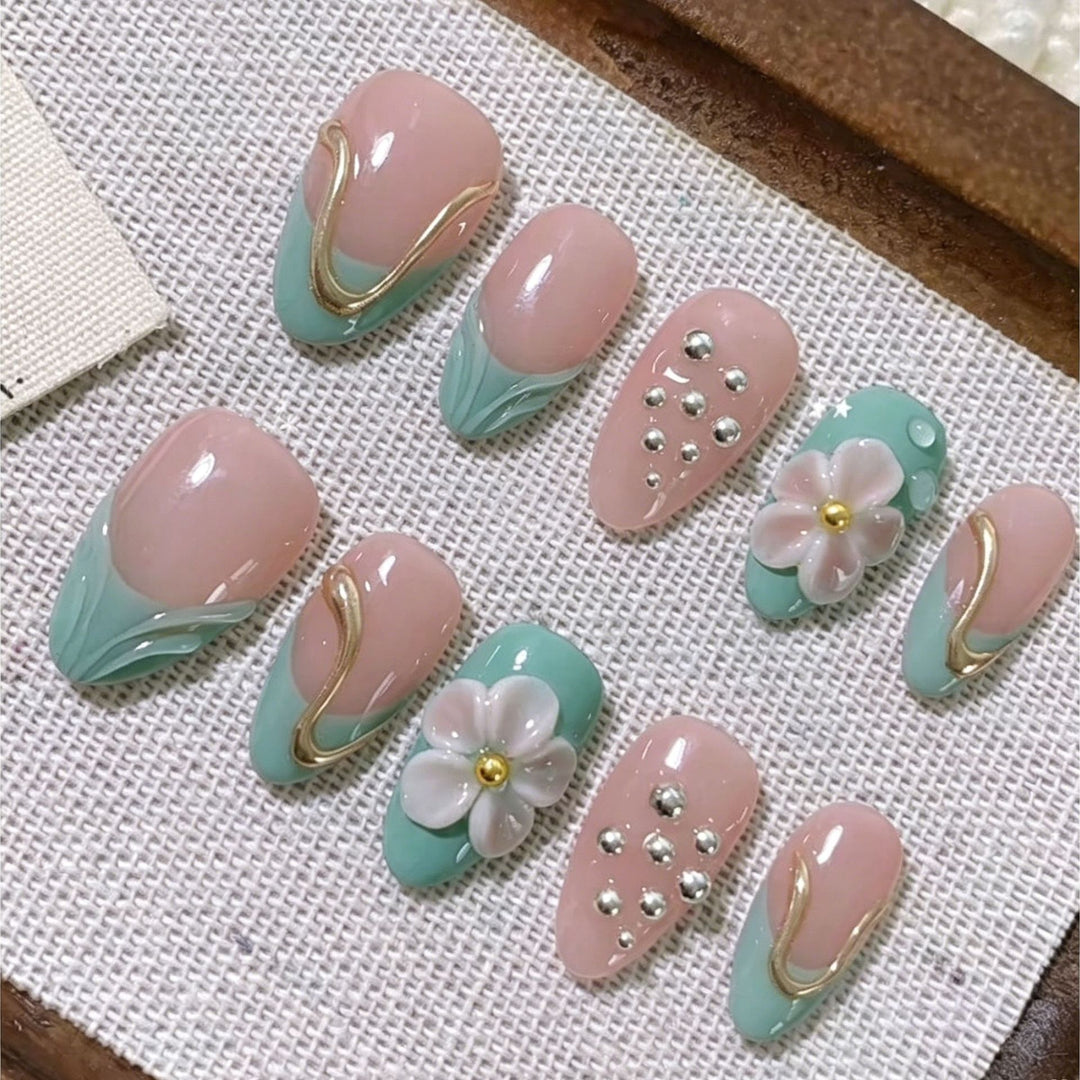 Artistic Press-On Nail Set with Floral and Metal Accents