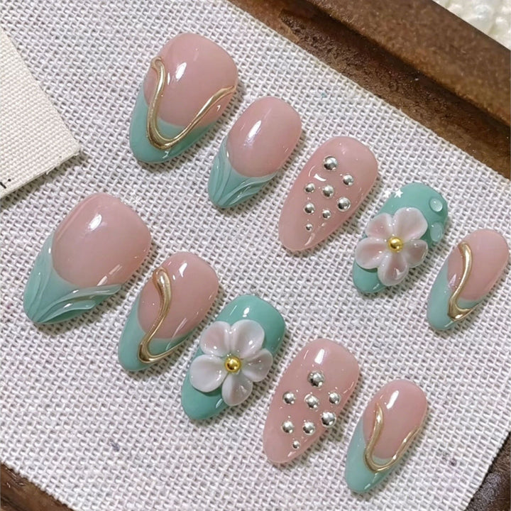 Artistic Press-On Nail Set with Floral and Metal Accents