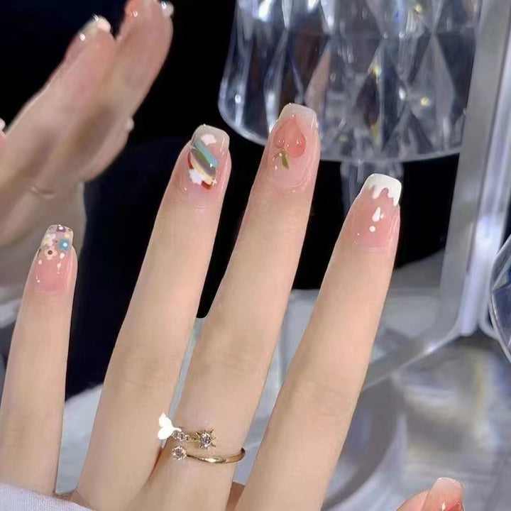 Creative nail art with fruit and flower motifs Kalsten