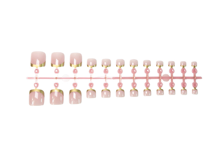 Toenail art set with elegant gold tips and delicate embellishments Kalsten