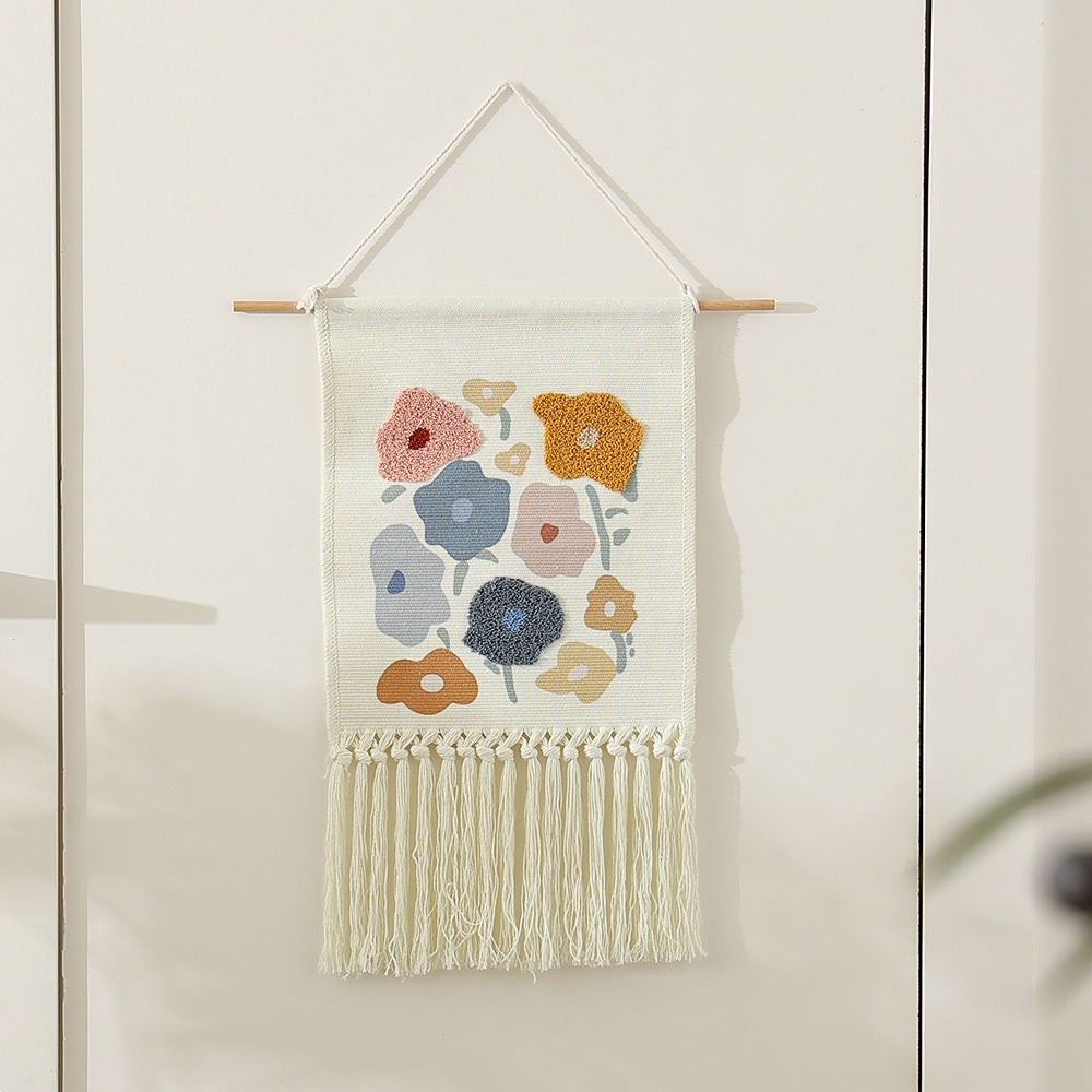 Woven cotton wall hanging with punch needle flower relief and fringes Kalsten