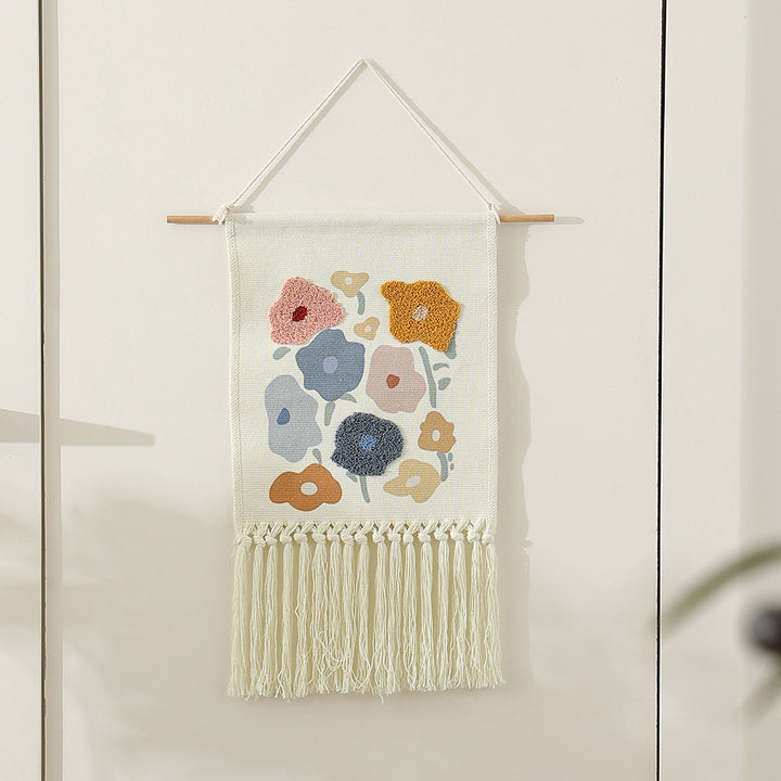 Woven cotton wall hanging with punch needle flower relief and fringes Kalsten