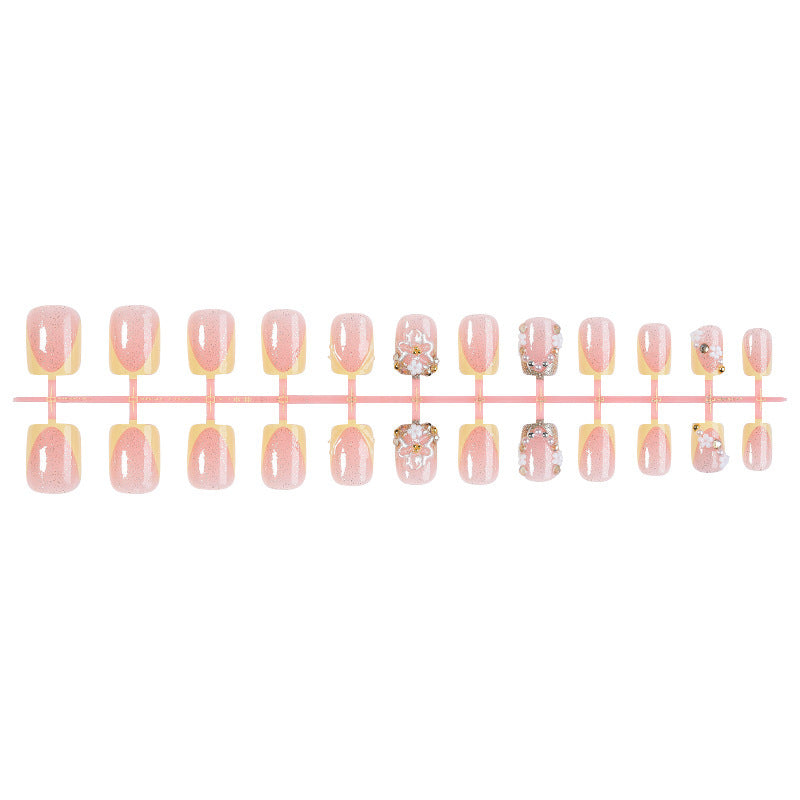Artificial nail set with floral design and glamorous embellishments Kalsten