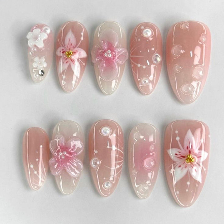 Artful stiletto nails with elegant floral design and glitter details Kalsten