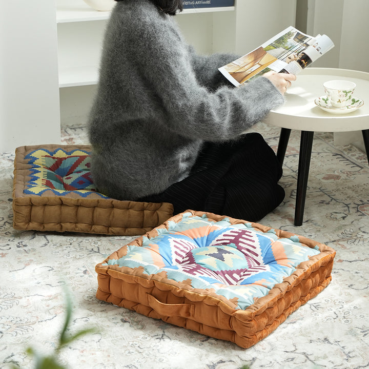 Padded seat and floor cushion with carrying handle and graphic ethno pattern Kalsten