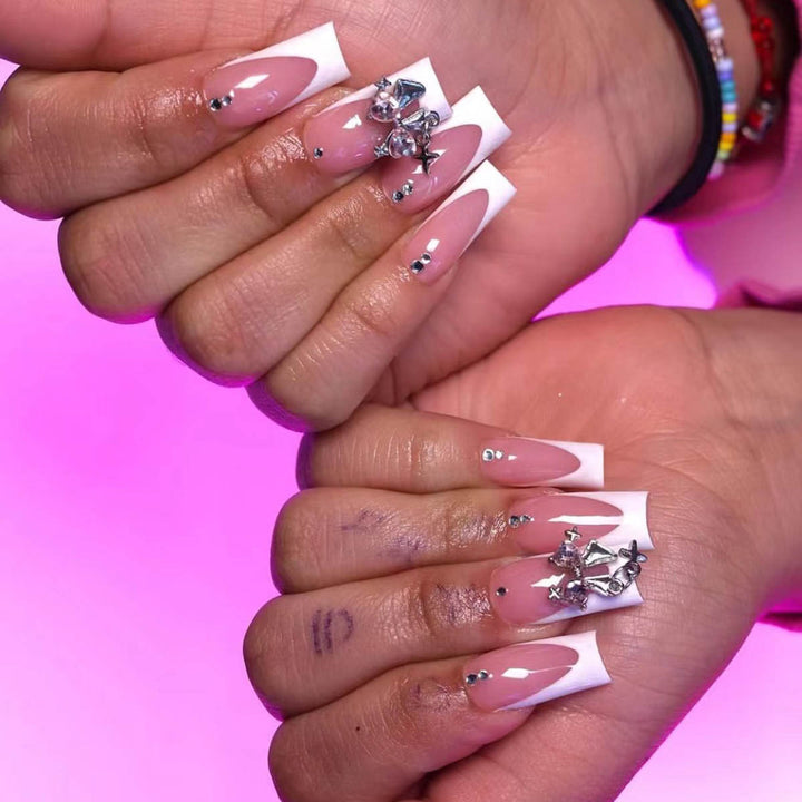 Artificial nail set with luxurious French tips and elegant embellishments Kalsten