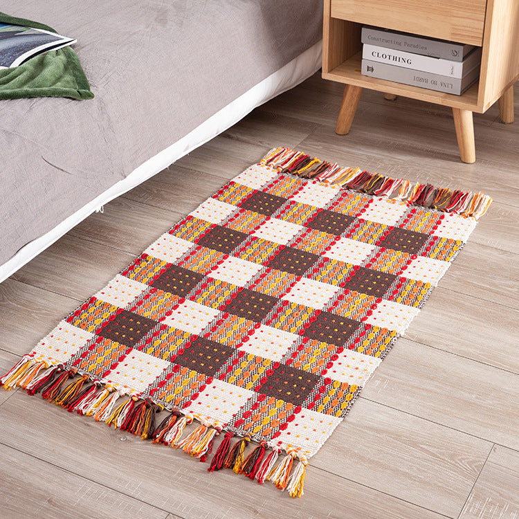 Striped cotton doormat with non-slip bottom and decorative woven edge Kalsten