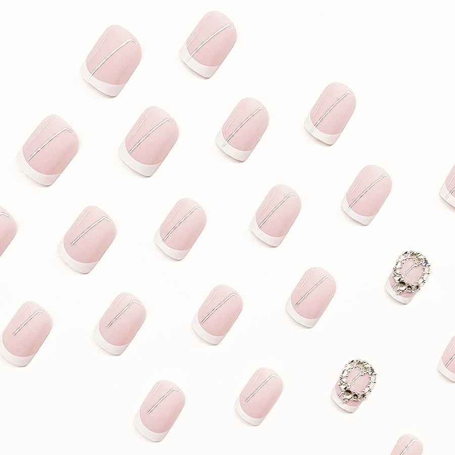Artificial nail set with elegant French design and rhinestone embellishments Kalsten