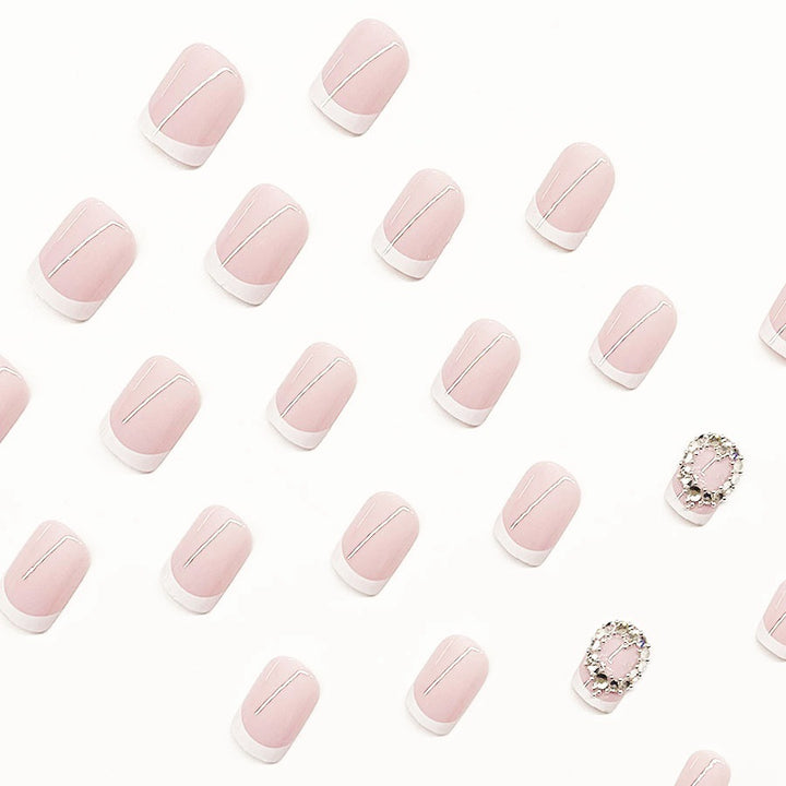 Artificial nail set with elegant French design and rhinestone embellishments Kalsten