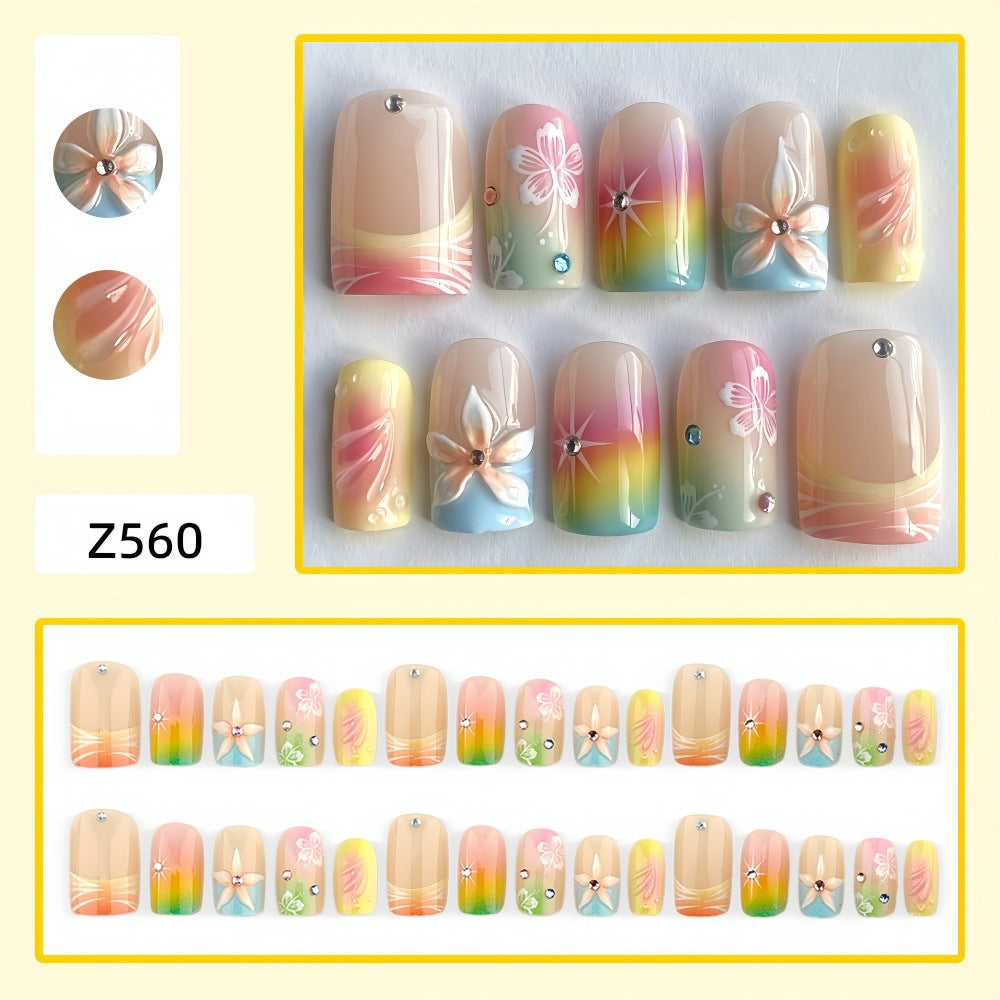 Acrylic nails with floral accents and gradient Kalsten