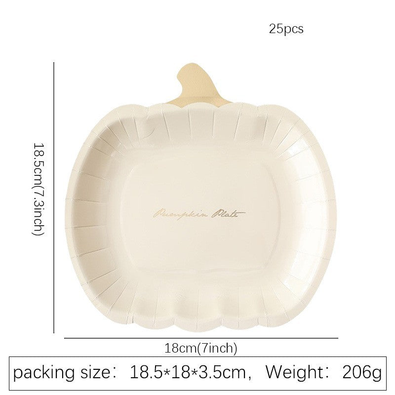 Disposable paper plates in pumpkin shape with spooky face design