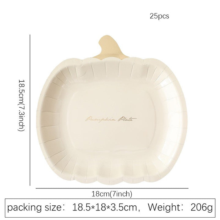 Disposable paper plates in pumpkin shape with spooky face design