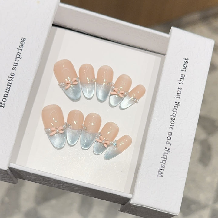 Artificial nail set with romantic bow and glitter accents Kalsten