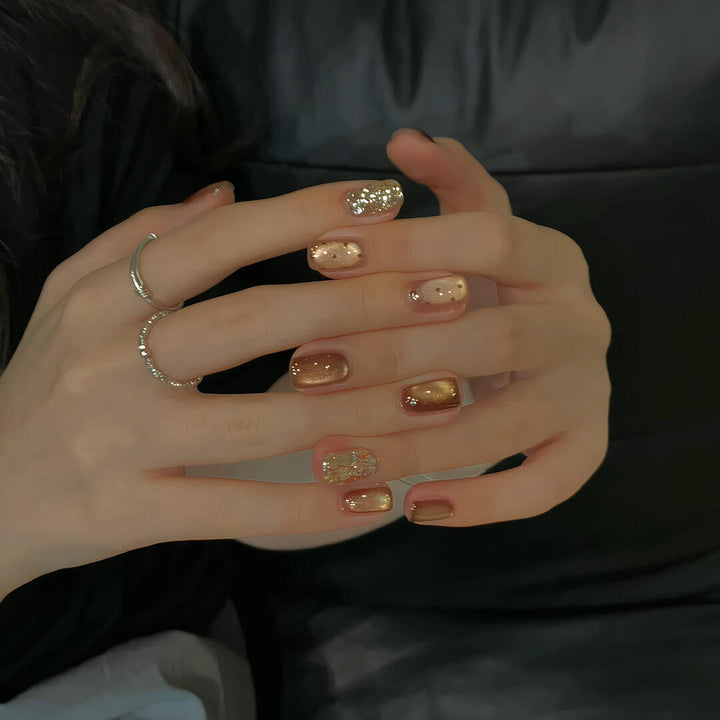 Elegant artificial nails with shimmering effects and sparkling accents Kalsten