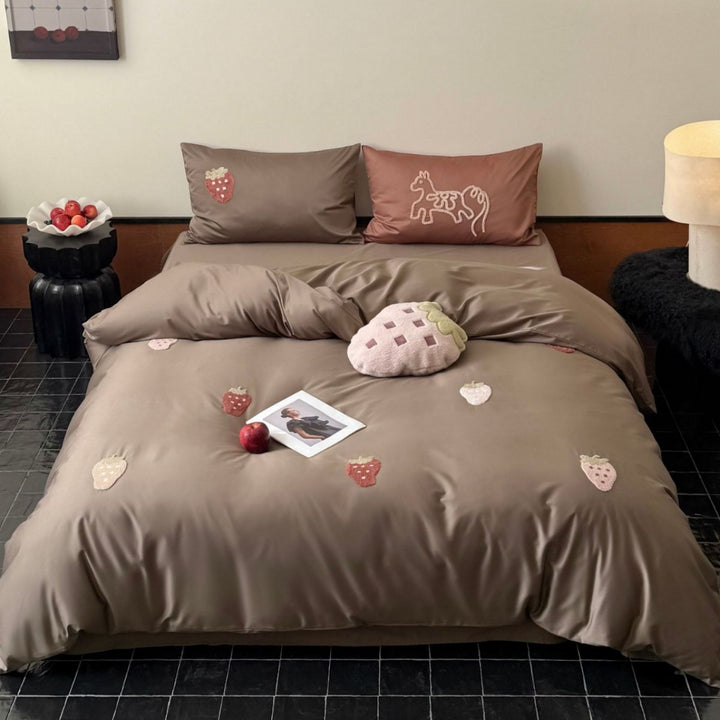 Luxurious cotton satin bedding set with embroidered strawberry appliqués